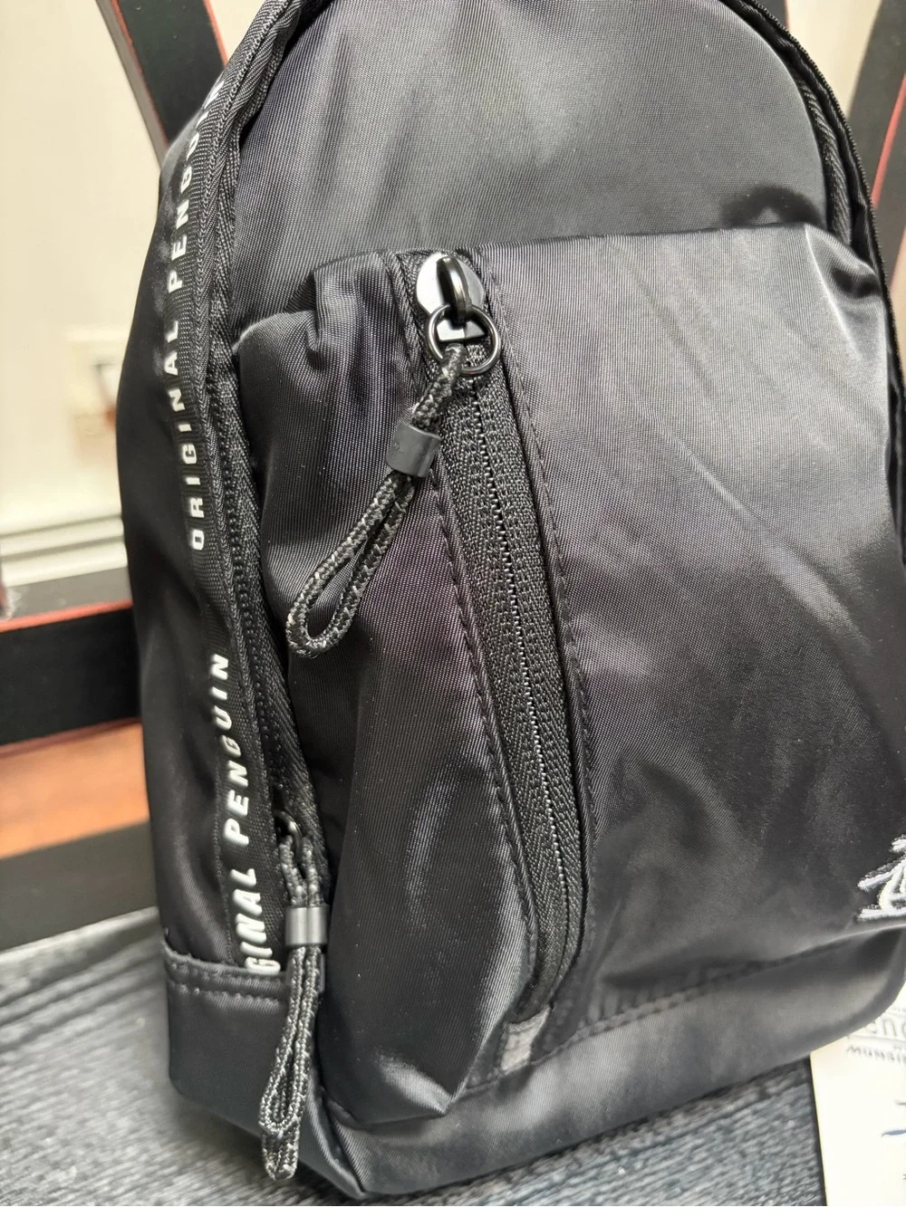 Original Penguin Black Sling Backpack with White Penguin Logo